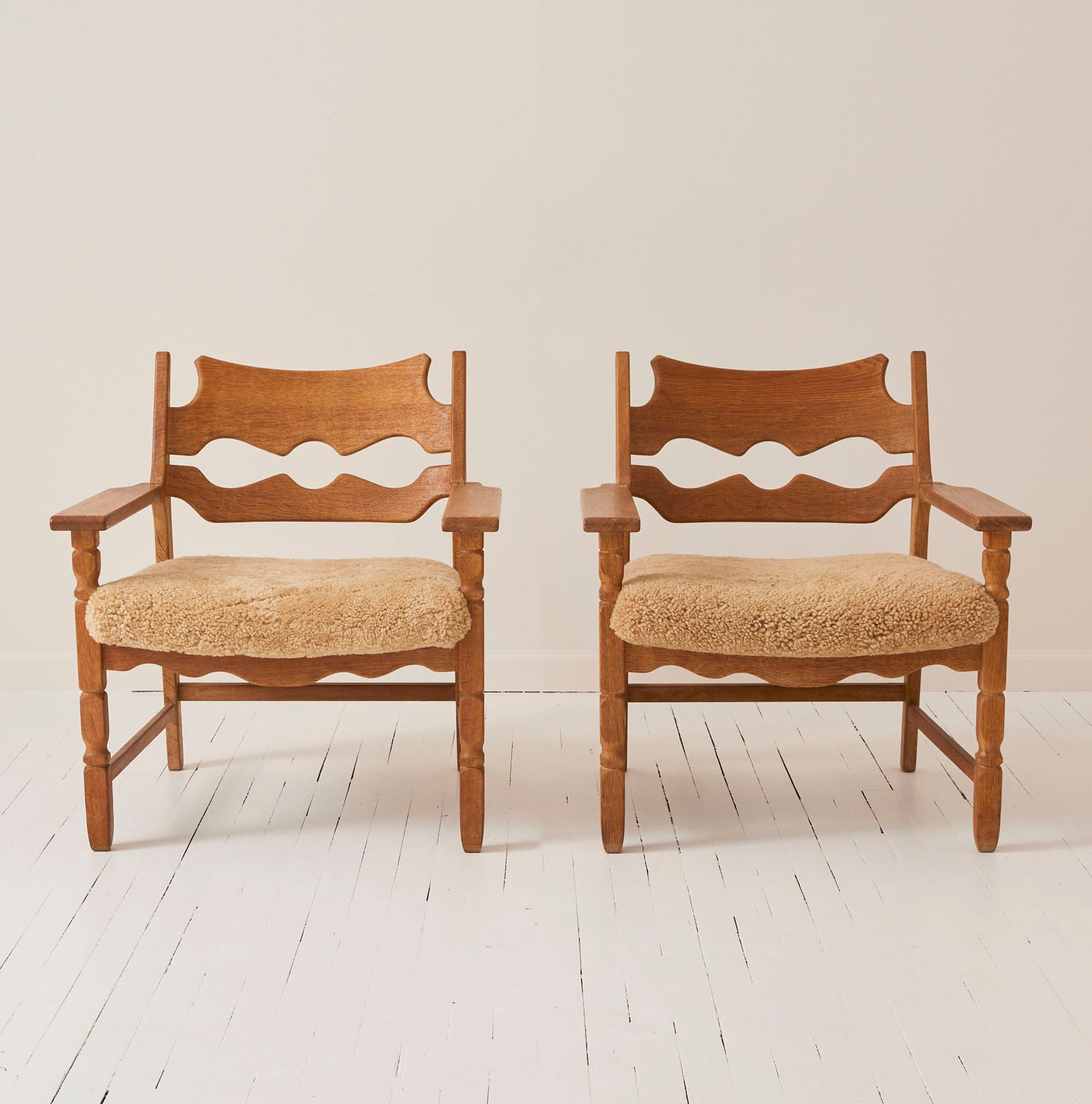 SOLD Henry Kjærnulf "Razorblade" Lounge Chairs in Oak and Sheepskin Seat, 1960s - Set of 2
