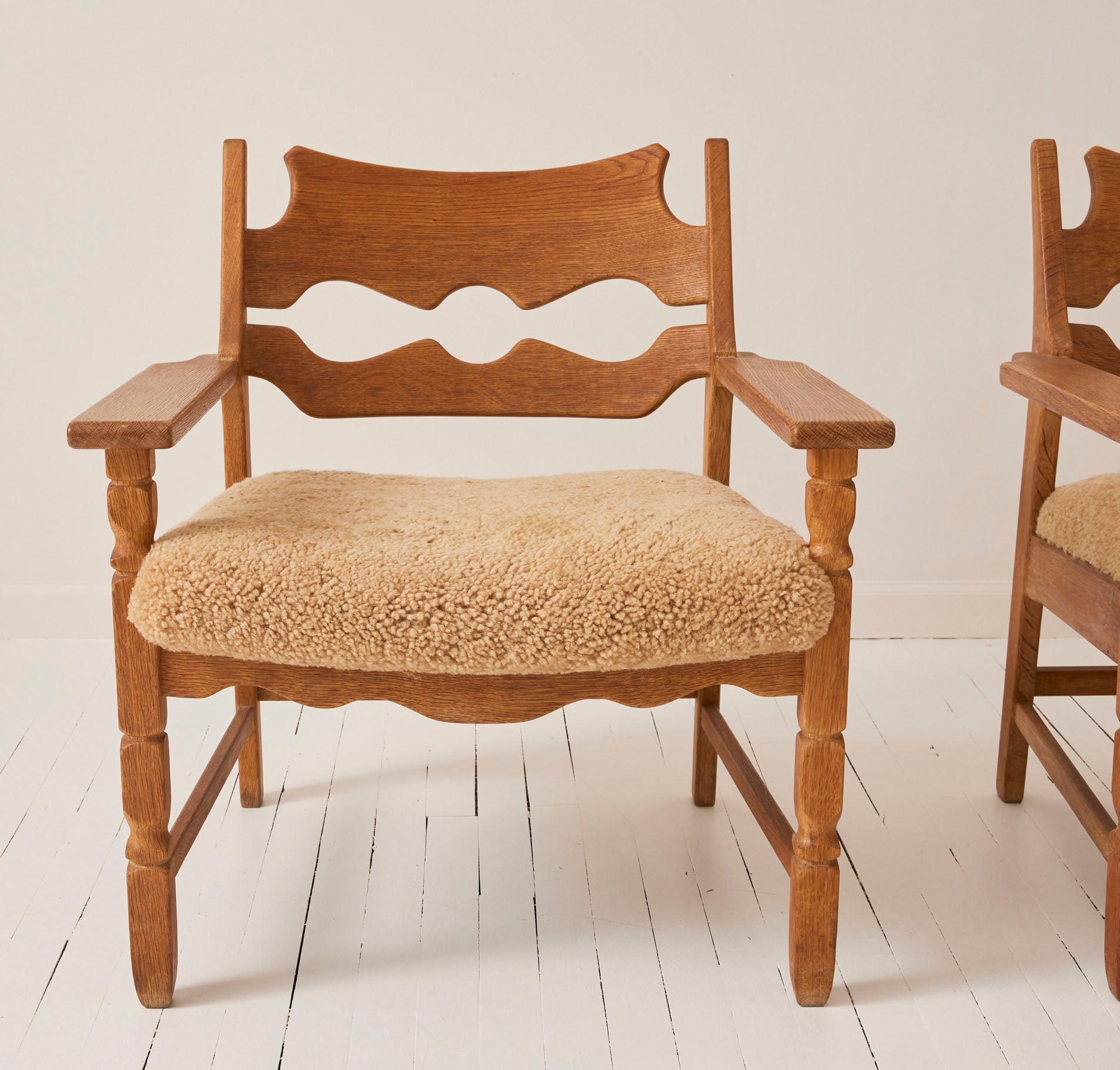 SOLD Henry Kjærnulf "Razorblade" Lounge Chairs in Oak and Sheepskin Seat, 1960s - Set of 2