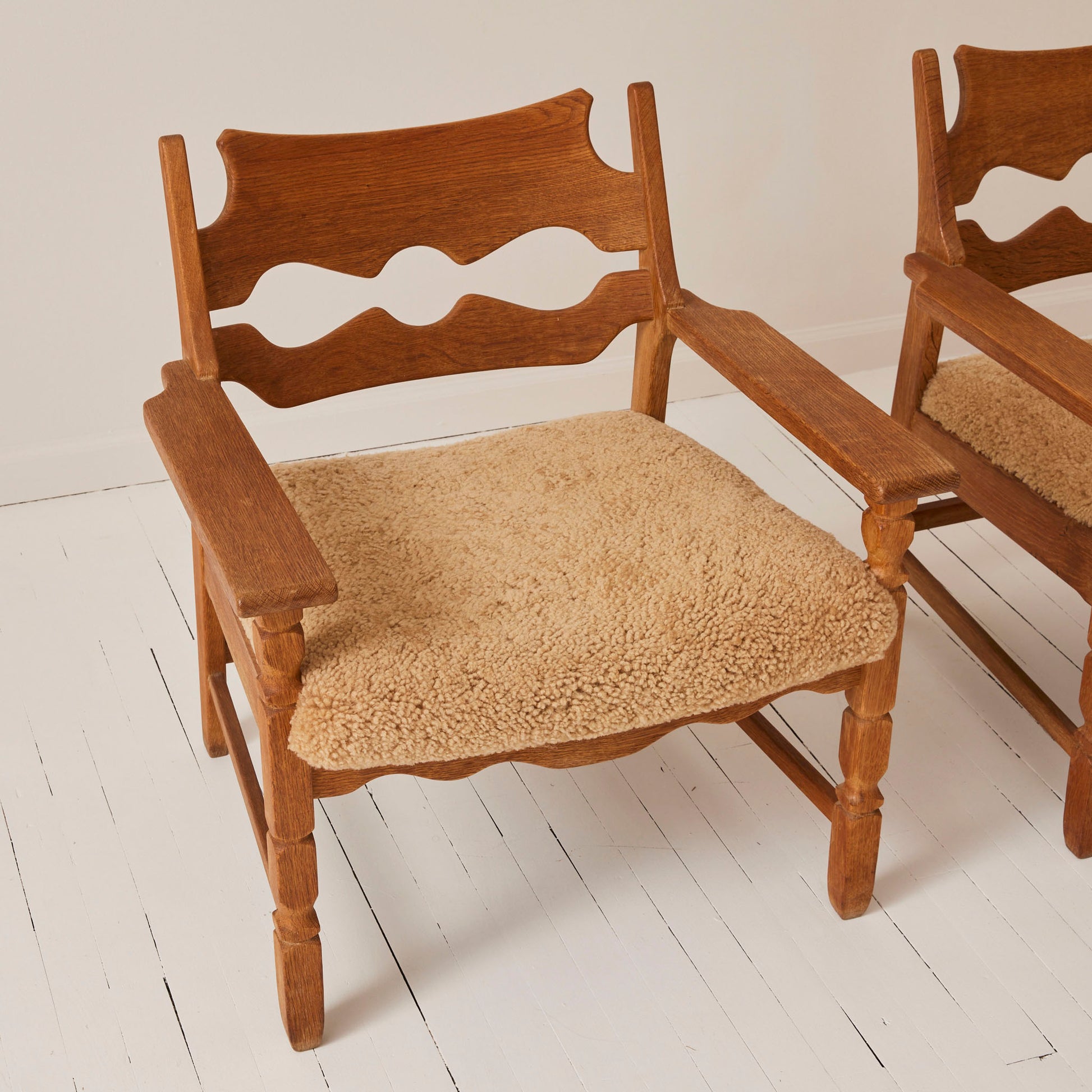 SOLD Henry Kjærnulf "Razorblade" Lounge Chairs in Oak and Sheepskin Seat, 1960s - Set of 2