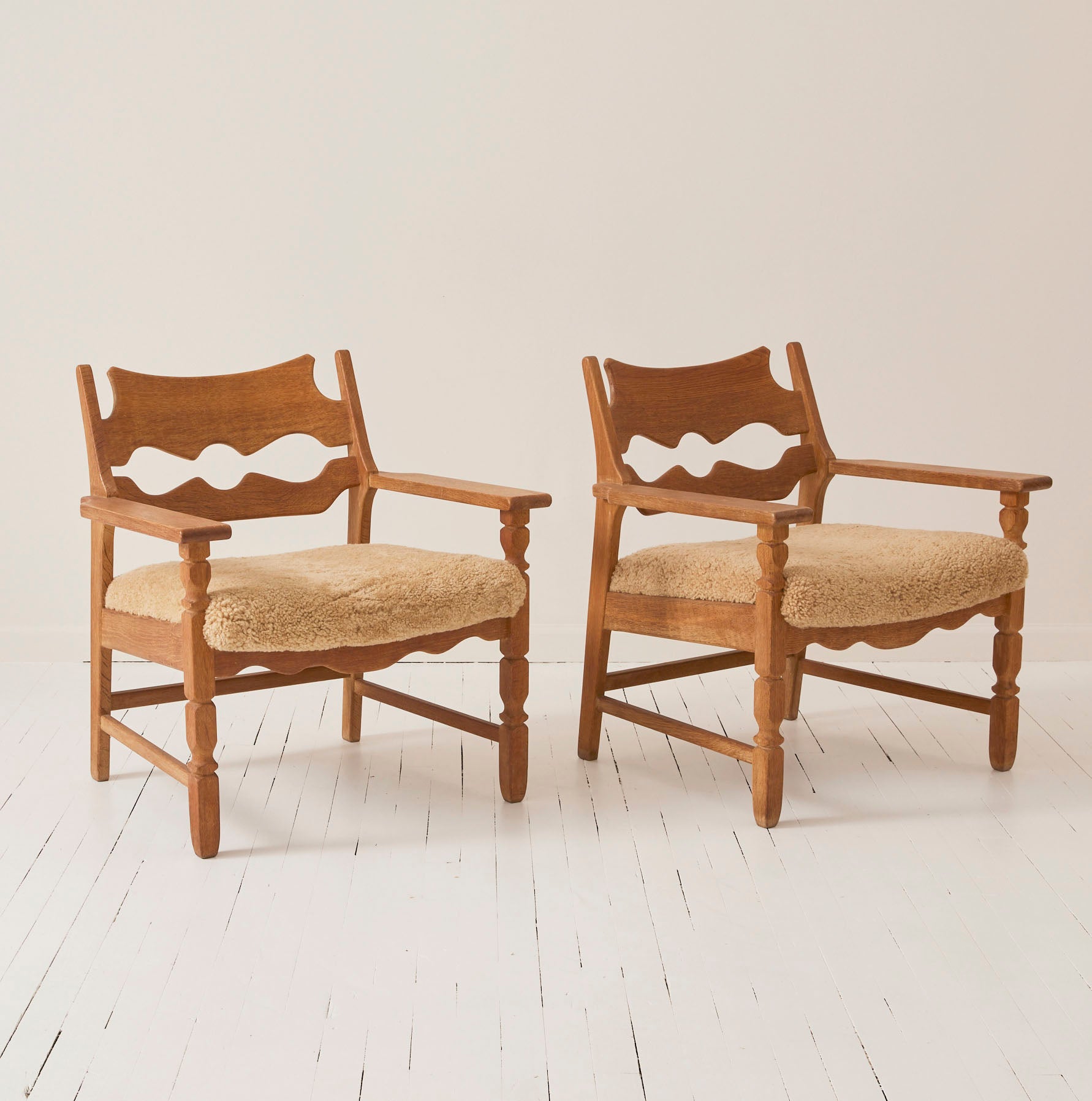 SOLD Henry Kjærnulf "Razorblade" Lounge Chairs in Oak and Sheepskin Seat, 1960s - Set of 2
