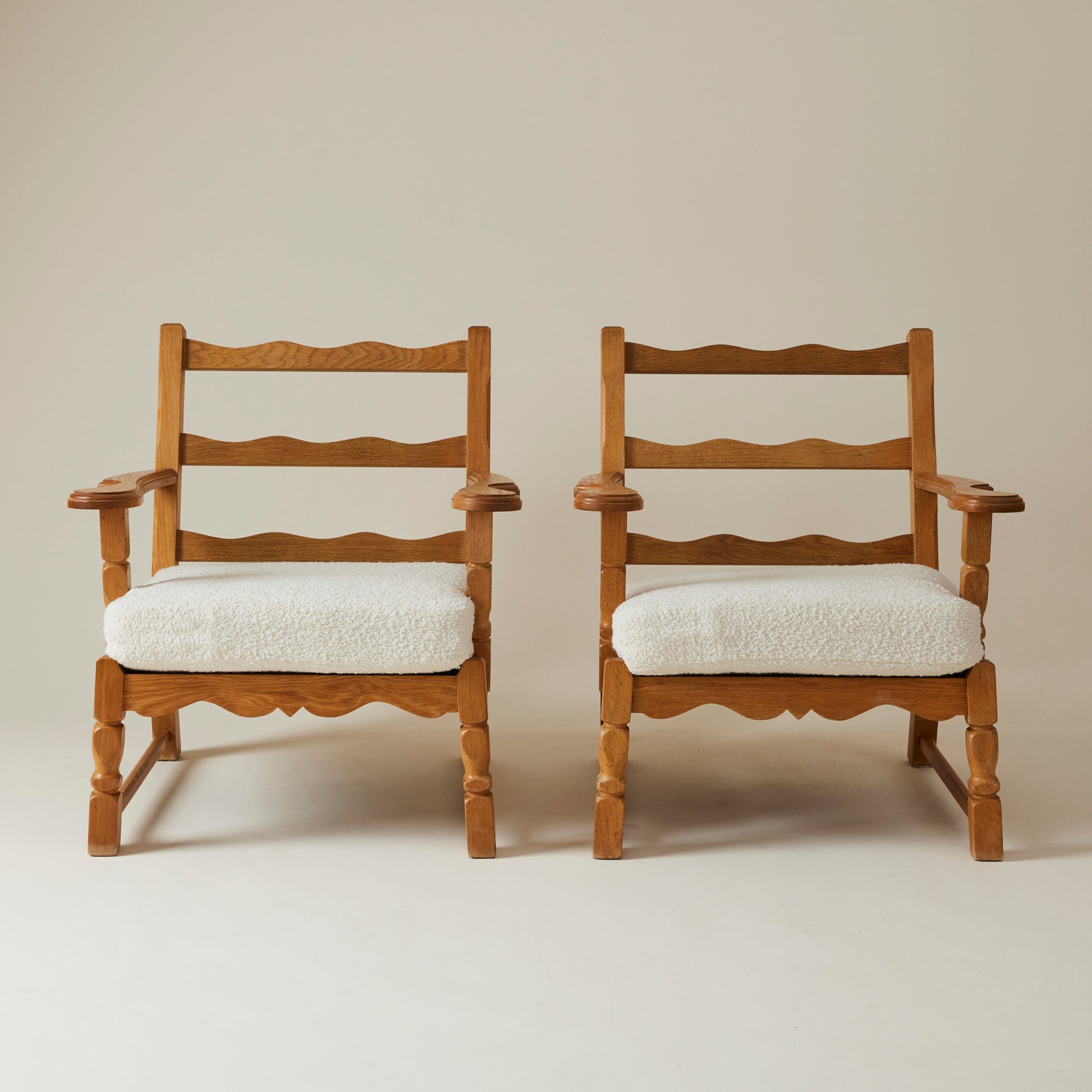 SOLD Swedish Oak Lounge Chairs with boucle cushion, 1960's, a pair