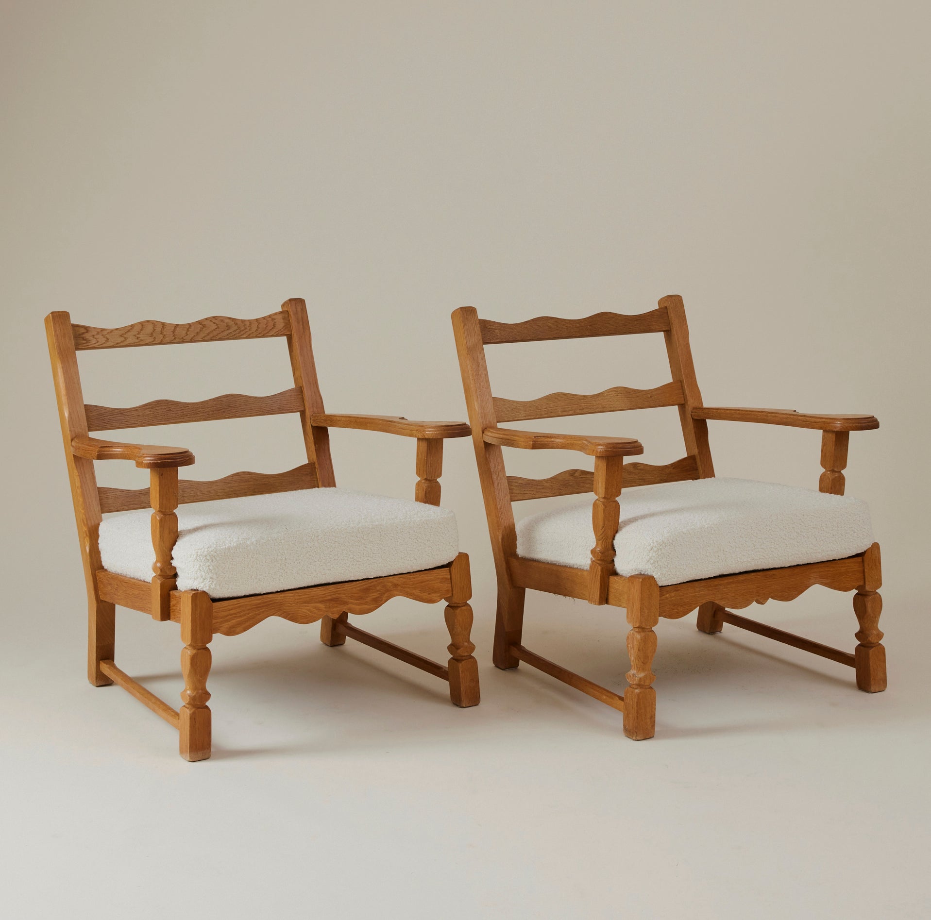 SOLD Swedish Oak Lounge Chairs with boucle cushion, 1960's, a pair