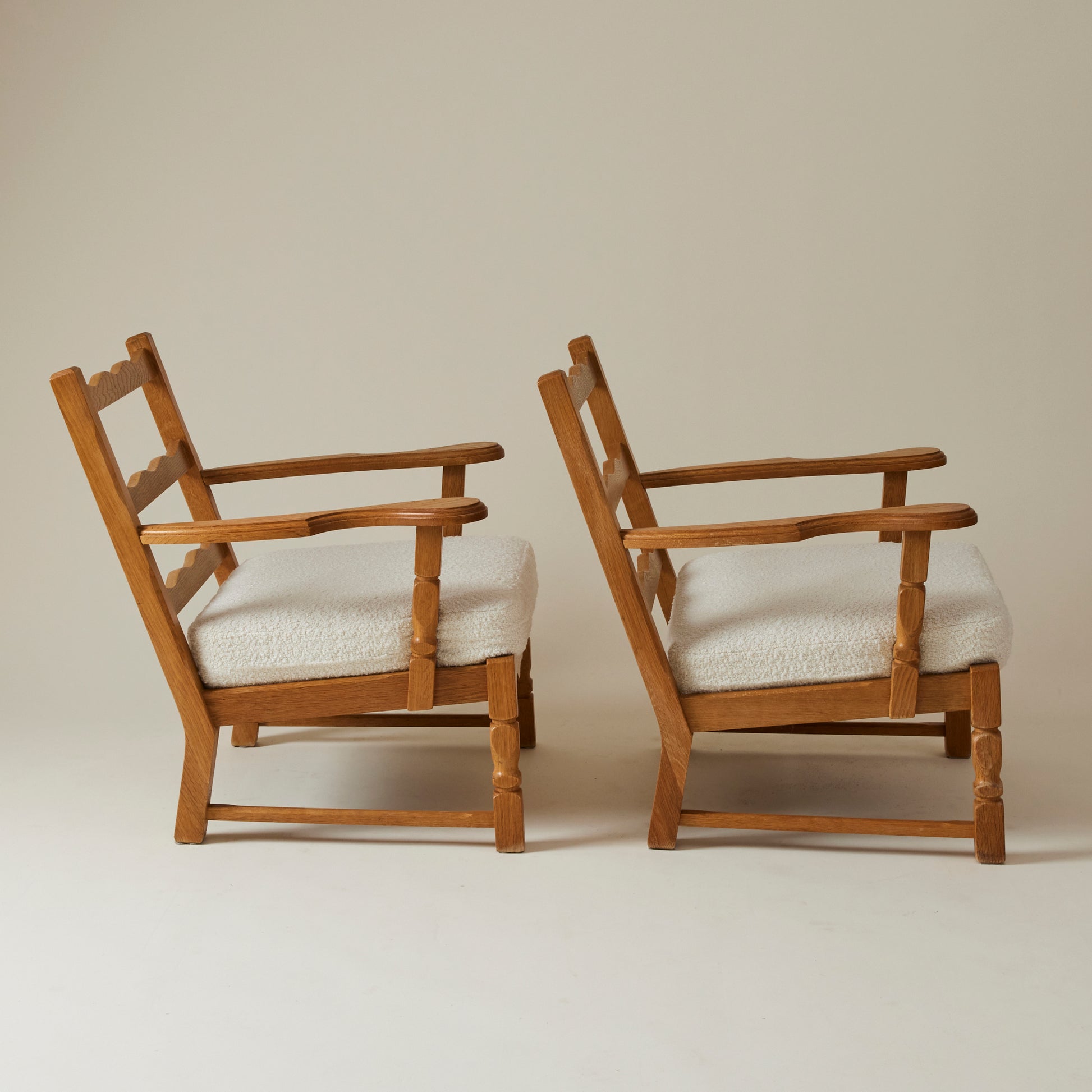 SOLD Swedish Oak Lounge Chairs with boucle cushion, 1960's, a pair