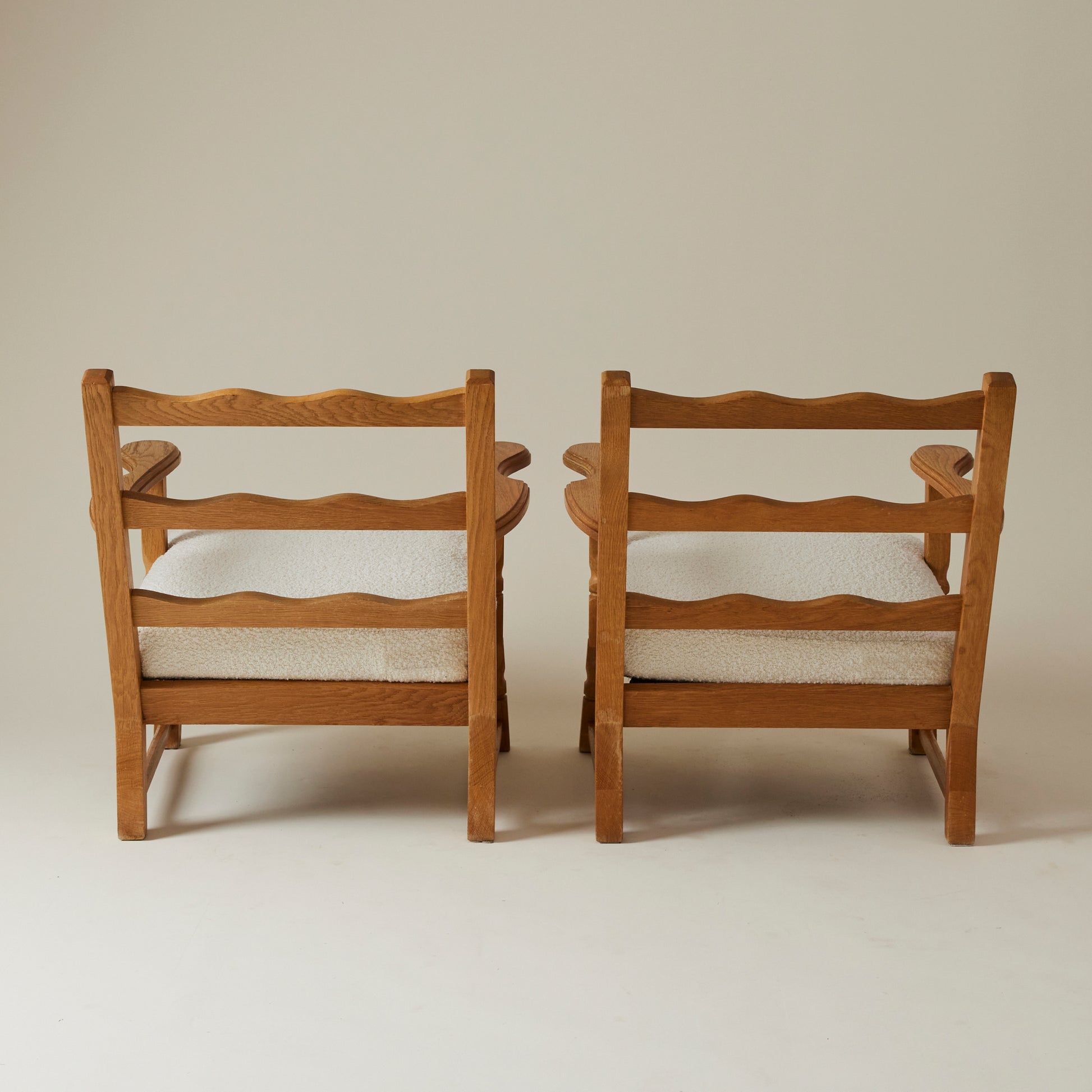 SOLD Swedish Oak Lounge Chairs with boucle cushion, 1960's, a pair