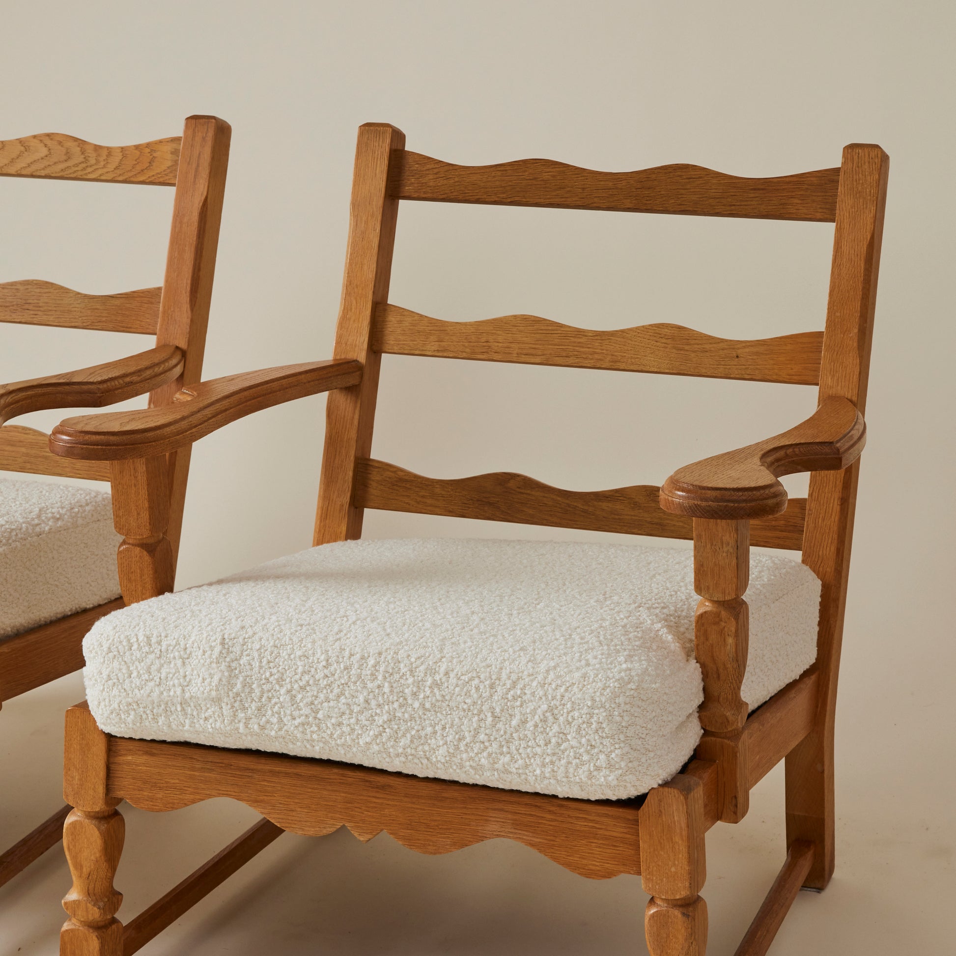 SOLD Swedish Oak Lounge Chairs with boucle cushion, 1960's, a pair