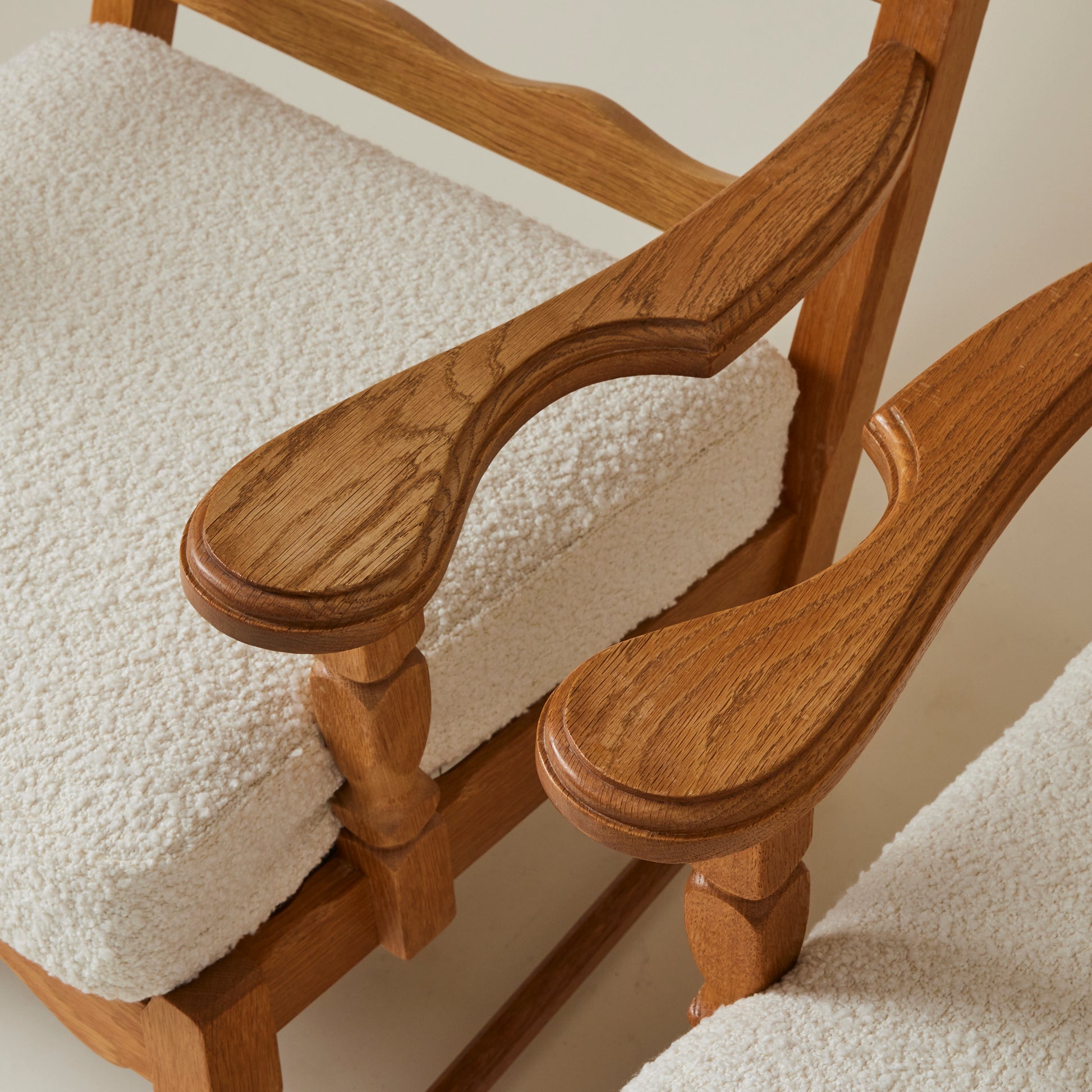 SOLD Swedish Oak Lounge Chairs with boucle cushion, 1960's, a pair