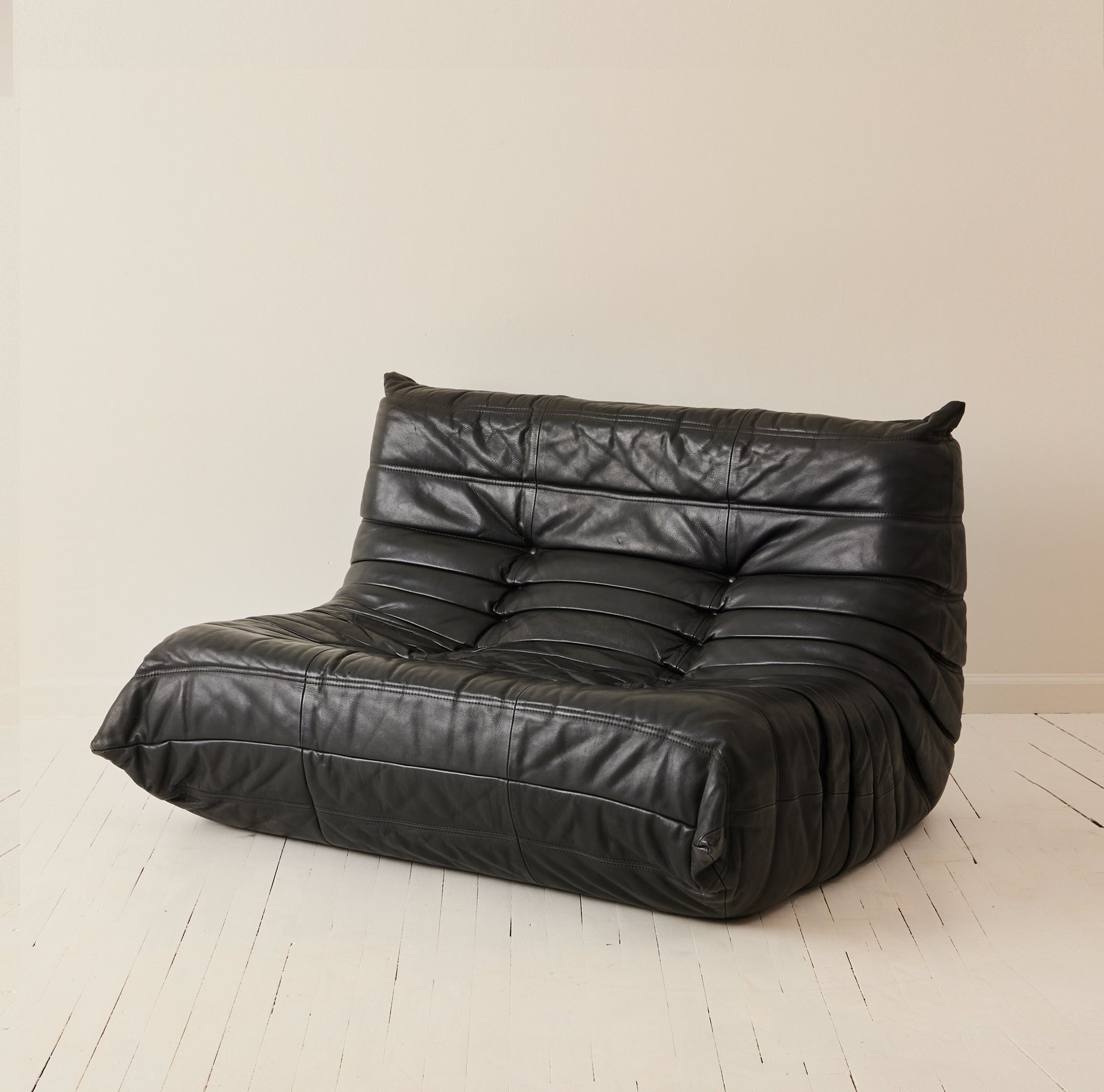Ligne Roset "Togo" 2 person sofa in black leather, 1970's.